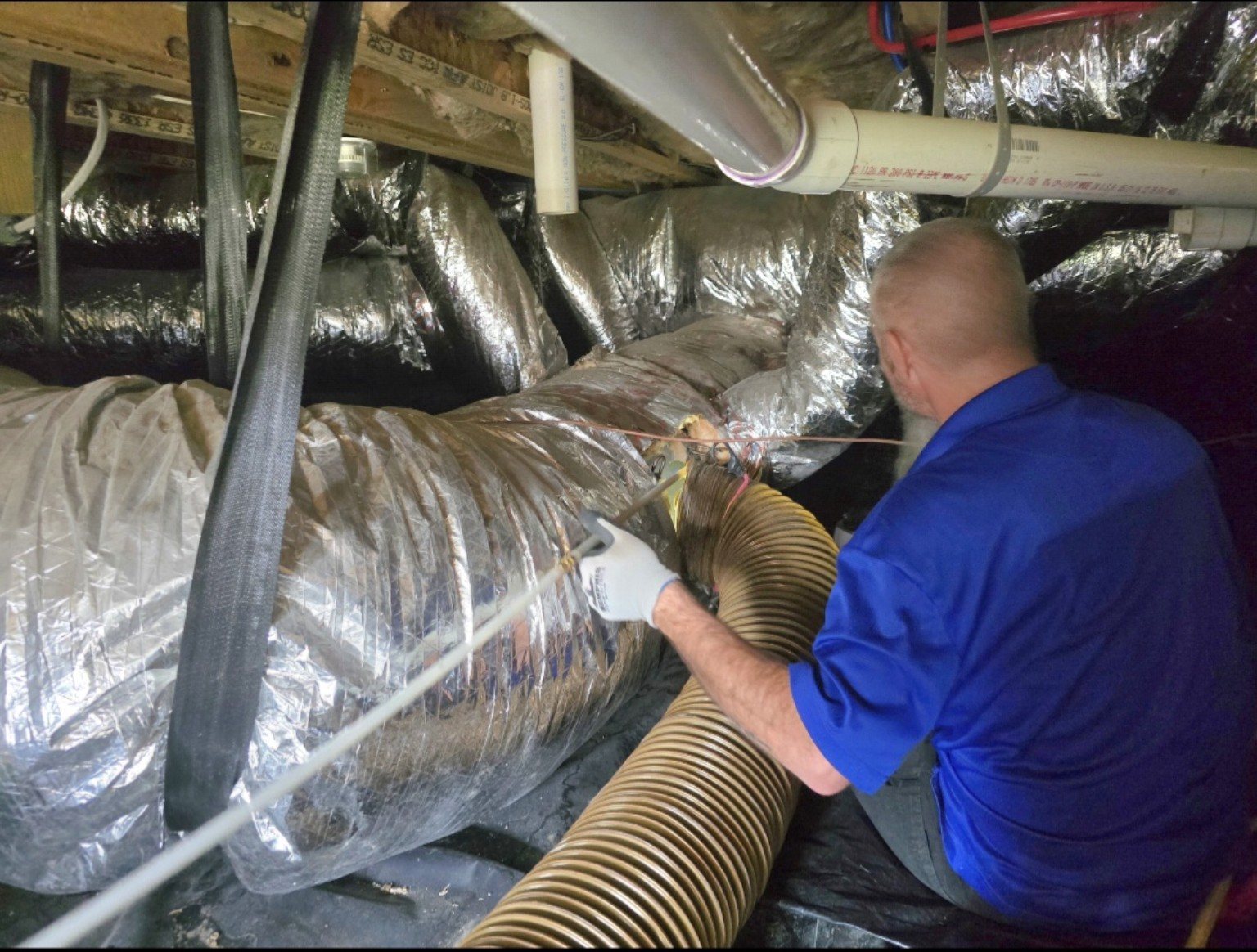 Duct system under negative pressure during professional air duct cleaning in Nashville